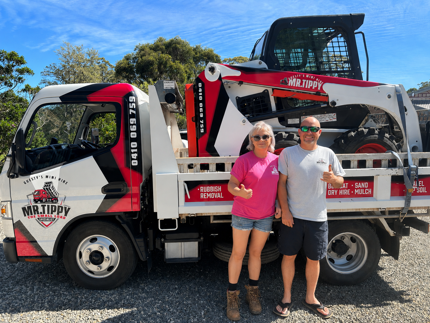 The Mr Tippy team standing in front of their mini tipper truck and bobcat